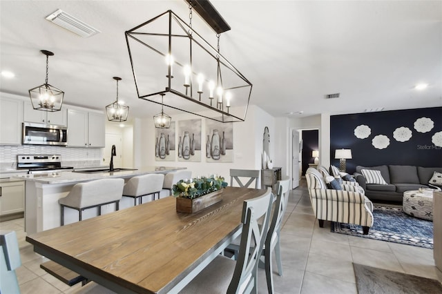 11861 Downy Birch Dr, Riverview, FL 33569 - dining space featuring light tile patterned floors