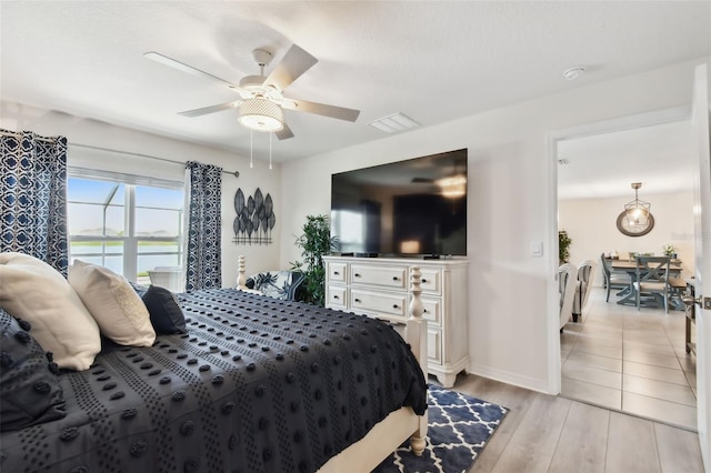 11861 Downy Birch Dr, Riverview, FL 33569 - bedroom with light wood-style flooring and a ceiling fan