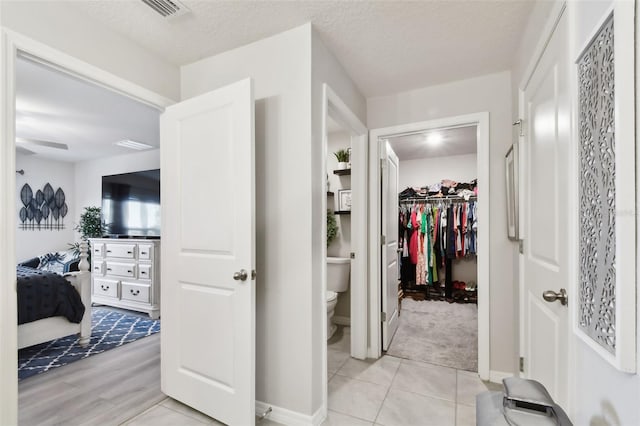 11861 Downy Birch Dr, Riverview, FL 33569 - hallway featuring light tile patterned floors