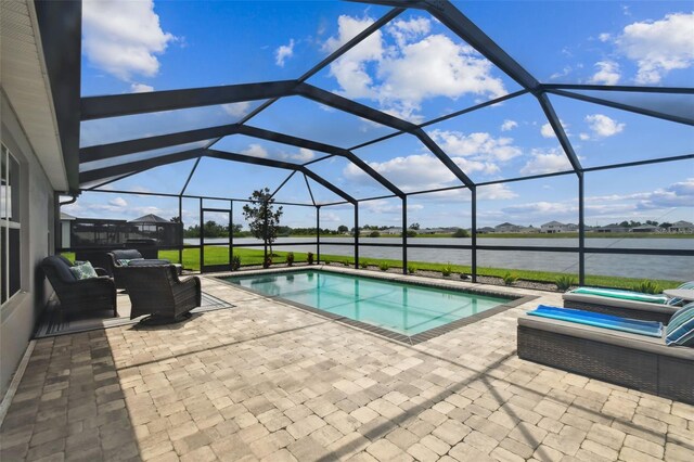 11861 Downy Birch Dr, Riverview, FL 33569 - swimming pool featuring a patio area, a water view, and glass enclosure