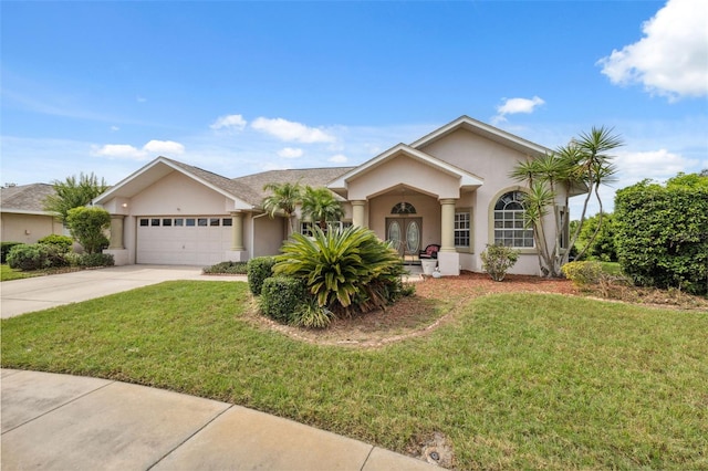 8921 Kilmer Way, Hudson, FL 34667 - ranch-style home featuring stucco siding, an attached garage, concrete driveway, and a front lawn