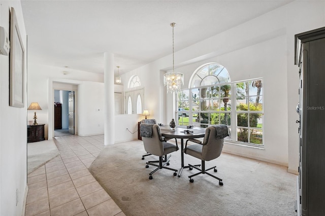 8921 Kilmer Way, Hudson, FL 34667 - dining area with light carpet, light tile patterned floors, and a chandelier