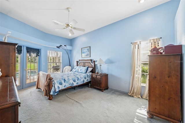 8921 Kilmer Way, Hudson, FL 34667 - bedroom with access to outside, carpet flooring, multiple windows, and a ceiling fan