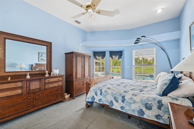 8921 Kilmer Way, Hudson, FL 34667 - bedroom featuring light carpet, access to exterior, and ceiling fan