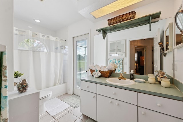 8921 Kilmer Way, Hudson, FL 34667 - full bathroom with vanity, tile patterned flooring, and shower / bath combo with shower curtain