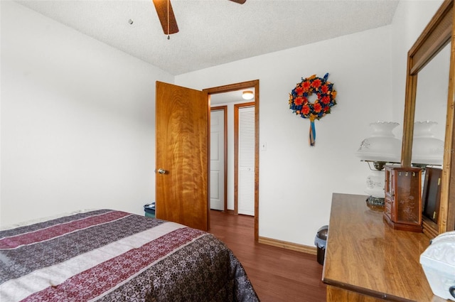 13825 San Juan Ave, Hudson, FL 34667 - bedroom featuring wood finished floors, a textured ceiling, and ceiling fan
