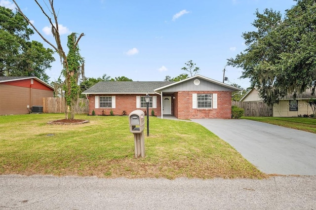 4905 Toni Ave, Lakeland, FL 33812 - ranch-style home featuring concrete driveway and brick siding