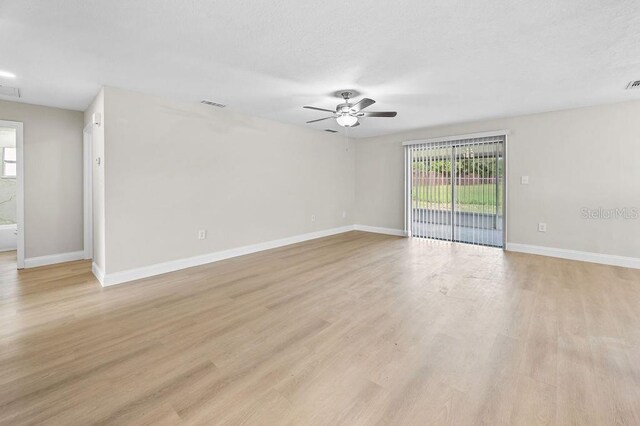 4905 Toni Ave, Lakeland, FL 33812 - unfurnished room with a ceiling fan and light wood finished floors