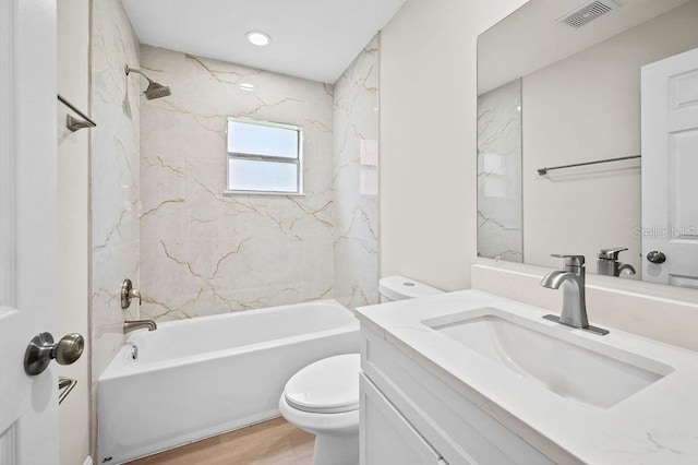 4905 Toni Ave, Lakeland, FL 33812 - bathroom featuring vanity,  shower combination, and wood finished floors