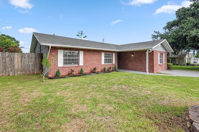 4905 Toni Ave, Lakeland, FL 33812 - ranch-style house with brick siding and a shingled roof