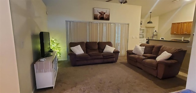7689 N Galt Pt, Dunnellon, FL 34434 - carpeted living area featuring vaulted ceiling