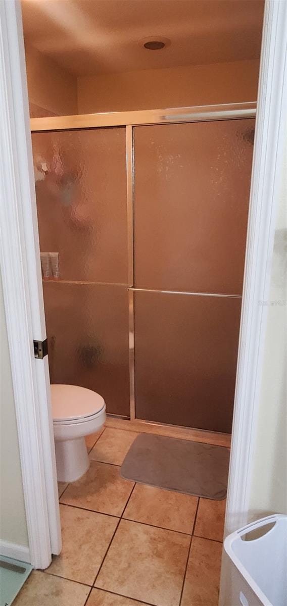7689 N Galt Pt, Dunnellon, FL 34434 - full bathroom featuring tile patterned floors and a stall shower