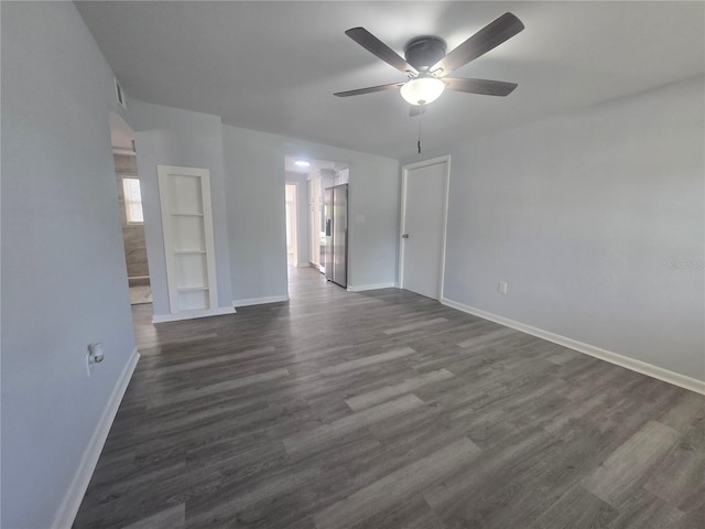 6730 Sandra Dr, Port Richey, FL 34668 - unfurnished room featuring a ceiling fan and dark wood finished floors