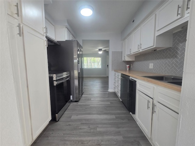6730 Sandra Dr, Port Richey, FL 34668 - kitchen with stainless steel range with electric cooktop, a ceiling fan, white cabinets, backsplash, and light countertops