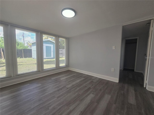 6730 Sandra Dr, Port Richey, FL 34668 - empty room featuring dark wood finished floors and baseboards