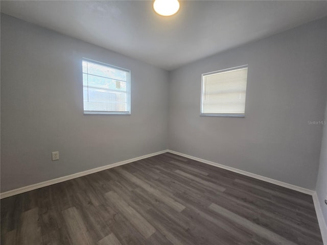 6730 Sandra Dr, Port Richey, FL 34668 - empty room featuring dark wood-type flooring and baseboards
