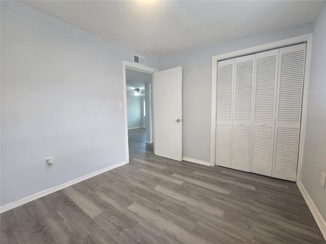 6730 Sandra Dr, Port Richey, FL 34668 - unfurnished bedroom featuring wood finished floors and a closet