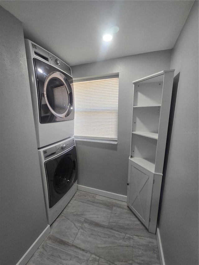 6730 Sandra Dr, Port Richey, FL 34668 - washroom featuring stacked washer / drying machine and baseboards