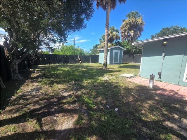 6730 Sandra Dr, Port Richey, FL 34668 - fenced backyard featuring a storage shed