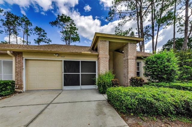9519 Scenic Pine Ct, New Port Richey, FL 34655 - view of front of property with concrete driveway and stucco siding