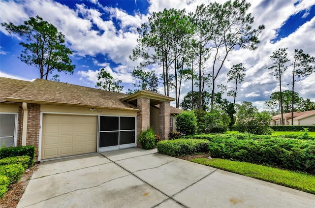 9519 Scenic Pine Ct, New Port Richey, FL 34655 - view of front of house with brick siding, driveway, and an attached garage