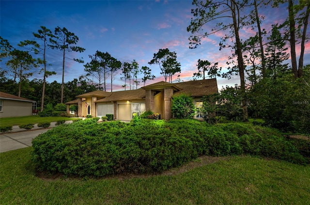 9519 Scenic Pine Ct, New Port Richey, FL 34655 - ranch-style home featuring an attached garage, driveway, and a front lawn