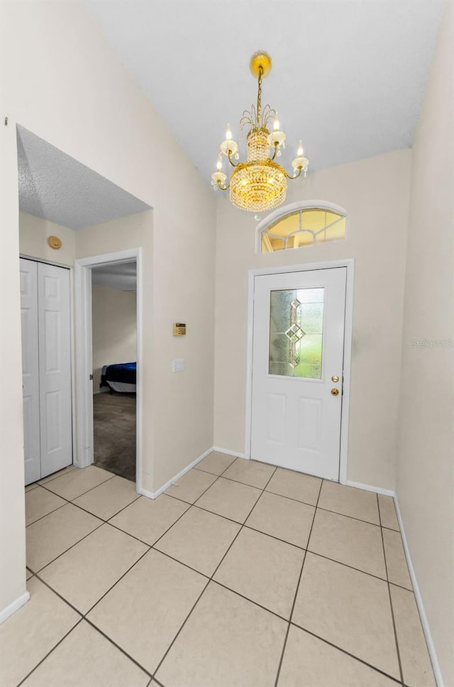9519 Scenic Pine Ct, New Port Richey, FL 34655 - entrance foyer featuring a chandelier and light tile patterned flooring