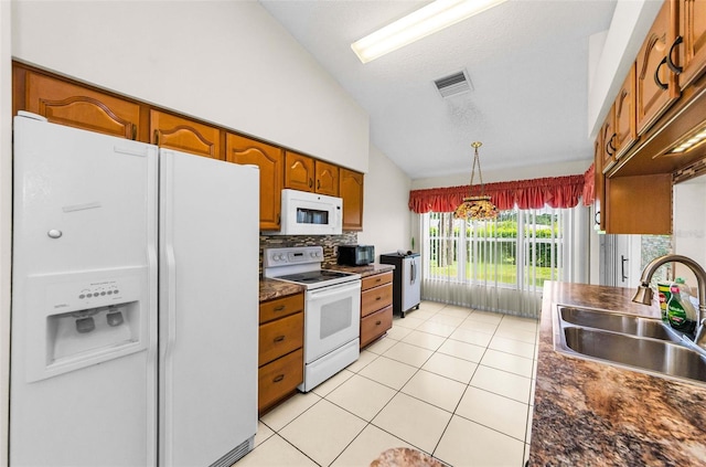 9519 Scenic Pine Ct, New Port Richey, FL 34655 - kitchen featuring white appliances, brown cabinetry, light tile patterned flooring, dark countertops, and tasteful backsplash