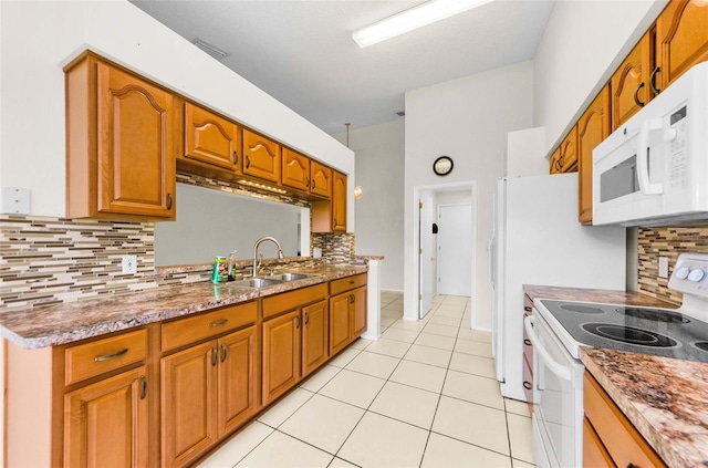 9519 Scenic Pine Ct, New Port Richey, FL 34655 - kitchen featuring white appliances, decorative backsplash, light tile patterned flooring, and brown cabinetry