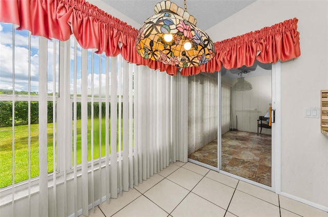 9519 Scenic Pine Ct, New Port Richey, FL 34655 - unfurnished dining area featuring baseboards and tile patterned floors