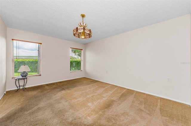 9519 Scenic Pine Ct, New Port Richey, FL 34655 - empty room with a chandelier and carpet floors