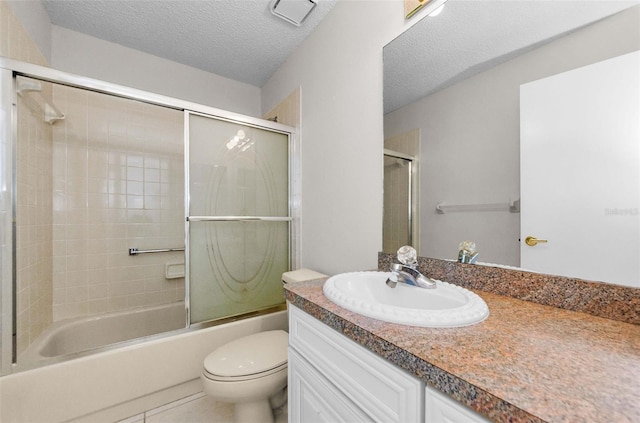 9519 Scenic Pine Ct, New Port Richey, FL 34655 - bathroom with vanity, shower / bath combination with glass door, a textured ceiling, and tile patterned flooring
