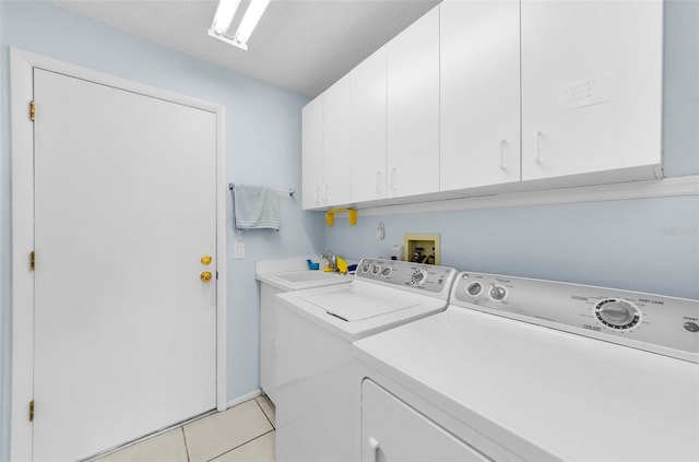 9519 Scenic Pine Ct, New Port Richey, FL 34655 - laundry area with separate washer and dryer, cabinet space, and light tile patterned flooring