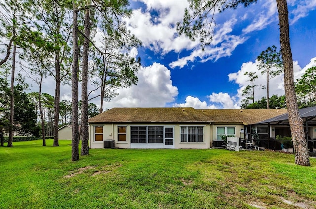 9519 Scenic Pine Ct, New Port Richey, FL 34655 - back of house with a yard and stucco siding