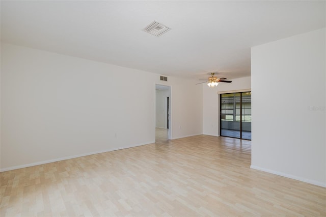 11127 Water Oak Dr, Port Richey, FL 34668 - unfurnished room featuring light wood-style flooring and a ceiling fan