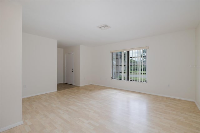11127 Water Oak Dr, Port Richey, FL 34668 - unfurnished room featuring light wood-type flooring and baseboards