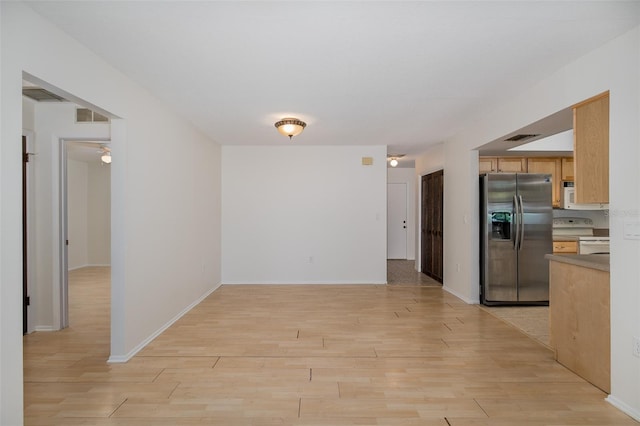 11127 Water Oak Dr, Port Richey, FL 34668 - kitchen featuring white appliances and light wood-type flooring