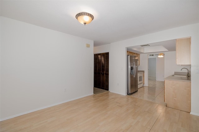 11127 Water Oak Dr, Port Richey, FL 34668 - unfurnished living room featuring light wood-style floors and ceiling fan