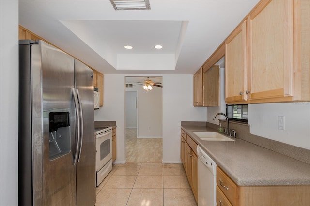 11127 Water Oak Dr, Port Richey, FL 34668 - kitchen featuring white appliances, a raised ceiling, ceiling fan, light brown cabinetry, and recessed lighting