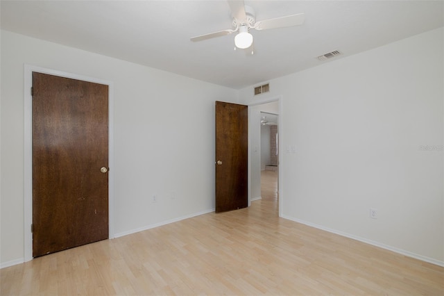 11127 Water Oak Dr, Port Richey, FL 34668 - spare room with light wood finished floors and a ceiling fan