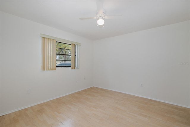 11127 Water Oak Dr, Port Richey, FL 34668 - spare room with light wood-style floors and ceiling fan