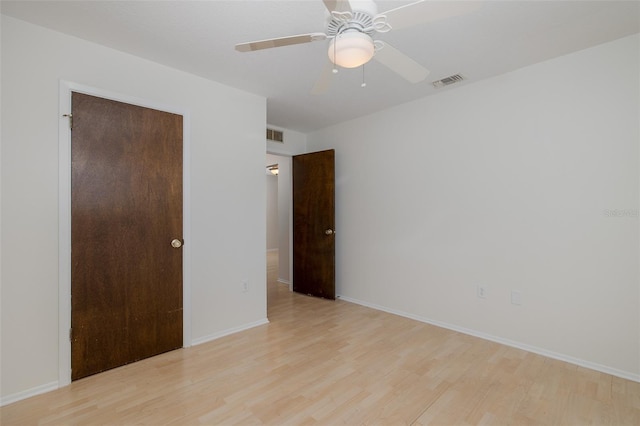 11127 Water Oak Dr, Port Richey, FL 34668 - unfurnished room featuring light wood-type flooring and a ceiling fan