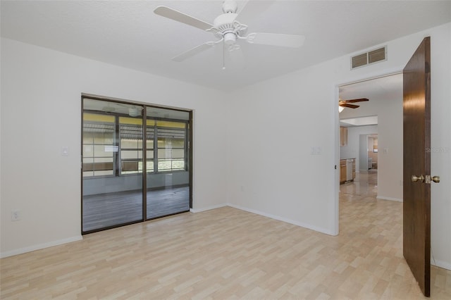 11127 Water Oak Dr, Port Richey, FL 34668 - spare room with a ceiling fan and light wood-style floors