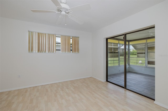 11127 Water Oak Dr, Port Richey, FL 34668 - unfurnished room with wood finished floors and a ceiling fan