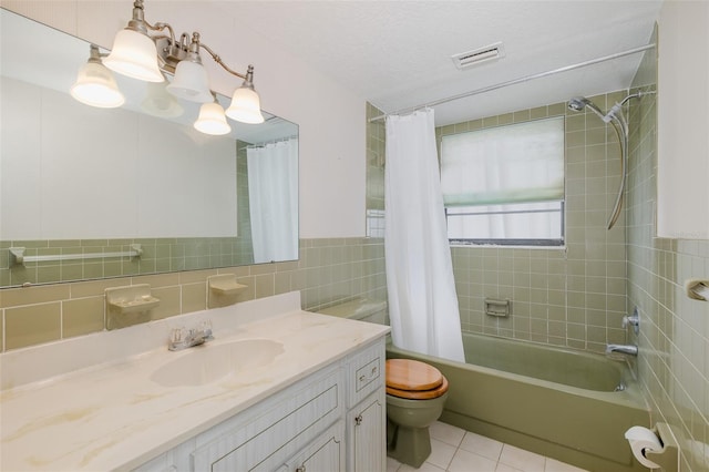 11127 Water Oak Dr, Port Richey, FL 34668 - bathroom featuring tile walls, vanity, shower / bathtub combination with curtain, and tile patterned flooring
