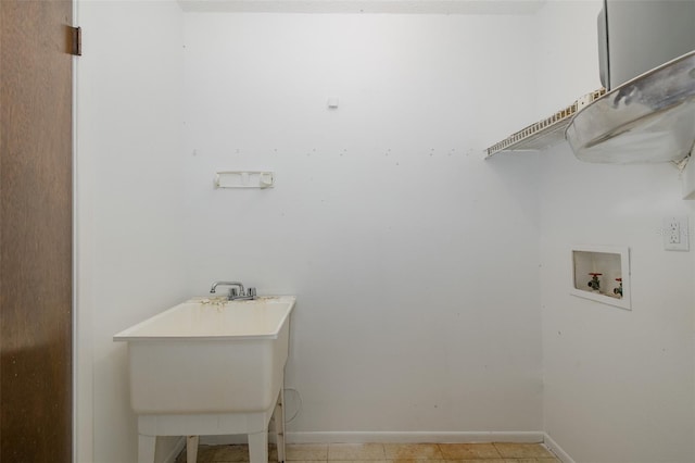 11127 Water Oak Dr, Port Richey, FL 34668 - laundry room with washer hookup and baseboards