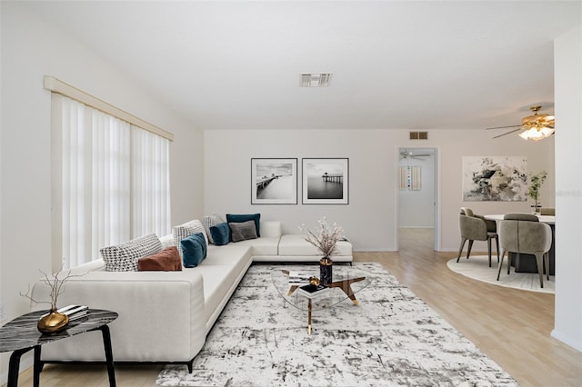 11127 Water Oak Dr, Port Richey, FL 34668 - living area with wood finished floors and a ceiling fan