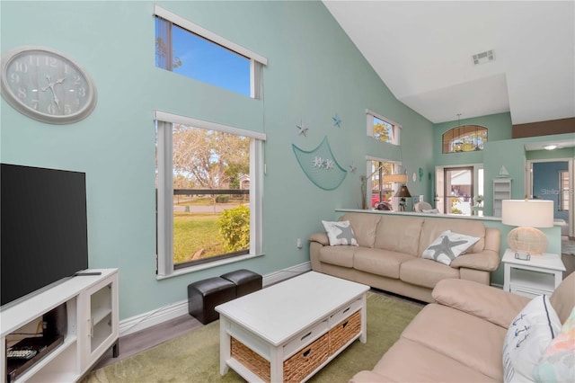 9626 Woodhollow Ct, New Port Richey, FL 34655 - living area featuring high vaulted ceiling, wood finished floors, and a chandelier
