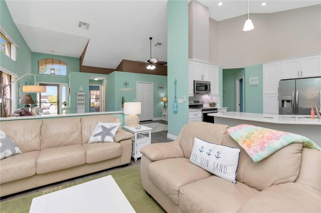 9626 Woodhollow Ct, New Port Richey, FL 34655 - living area featuring high vaulted ceiling, ceiling fan, and recessed lighting