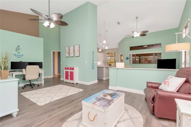 9626 Woodhollow Ct, New Port Richey, FL 34655 - living area featuring ceiling fan, high vaulted ceiling, an office area, and wood finished floors